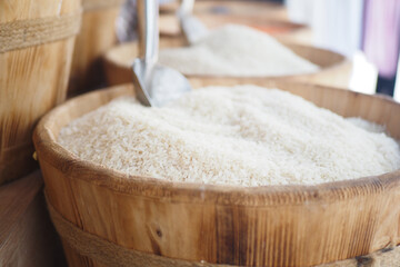 White rice displayed in woven baskets at a local market stall
