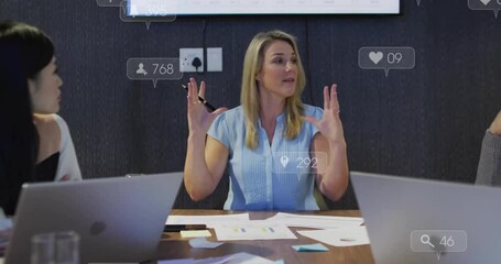 In conference room, businesswoman presenting animation on social media engagement metrics - Powered by Adobe