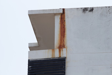 The old building has rust stains from long rains in Thailand.