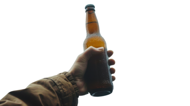Hand holding a cold beer bottle with condensation on transparent background