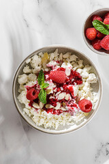 cottage cheese with raspberries and almond petals