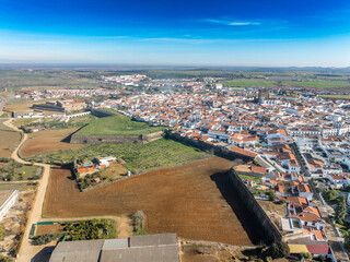 Aerial view of Olivenza's fortifications, a blend of Portuguese and Spanish styles, feature robust...
