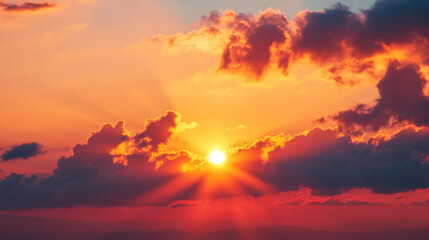 Fototapeta premium breathtaking sunrise with vibrant colors illuminating sky, showcasing rays of sunlight piercing through fluffy clouds. scene evokes sense of peace and wonder