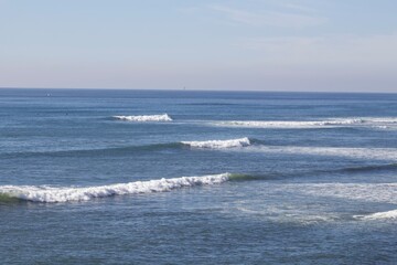 Beautiful rolling ocean waves on a sunny day in Calumet Park, San Diego, California