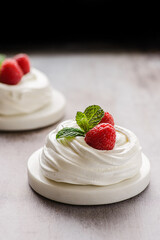 pavlova meringue dessert with raspberries and cream