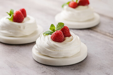 pavlova meringue dessert with raspberries and cream