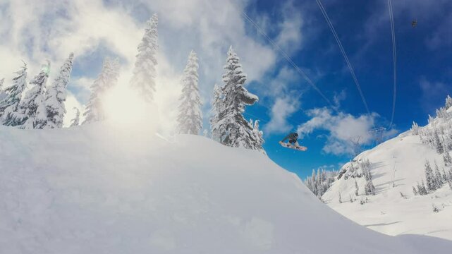 Snowboarding Method Grab Over Backcountry Powder