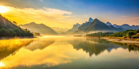 Early morning sunlight over the vast expanse of the Yellow River in Sichuan Province, with misty hills and towering mountains reflected in the calm water, Yellow River, nature photography