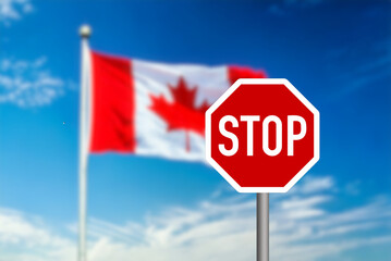 Flag of Canada and Stop sign at the Canadian border
