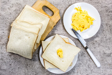 slices of bread with butter on the table as a breakfast menu
