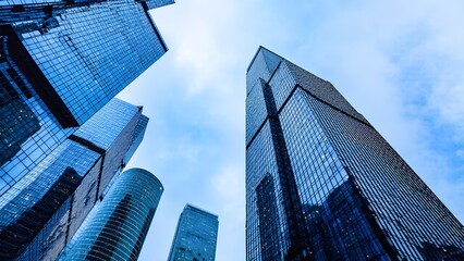 Skyward view of modern skyscrapers in an urban landscape architectural photography cloudy atmosphere city perspective