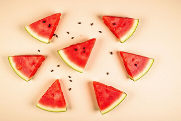 slices of watermelon on a beige background