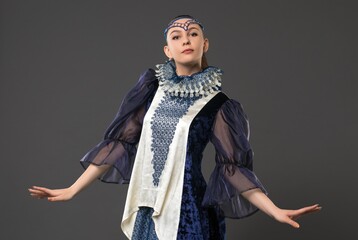 Dance performance showcasing intricate costume design and unique style