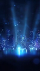 Fototapeta premium A vibrant city skyline illuminated by blue lights and reflections on water.