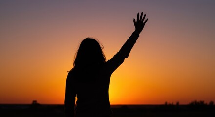Woman waving goodbye at sunset in serene landscape 