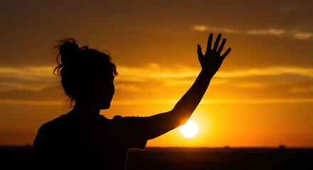 Woman waves goodbye to the sunset on a tranquil evening 