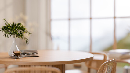 The set of a wooden round table and chair in the dining room or dining hall with large wall window.