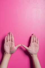Two open Asian hands forming a wide 