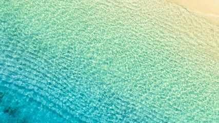 nature of the beach and sea Summer with sunshine, sandy beaches, clear blue waters sparkling against the blue sky. On an island with good ecology and environment Background for summer vacation