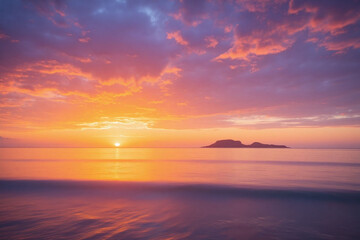 Obraz premium A colorful sunset over the ocean with a small island in the distance 2