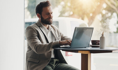 Typing, laptop and man in cafe as digital nomad for finance, sales report and budget. Coffee shop, happy freelancer and computer for writing email, online project or internet research for remote work