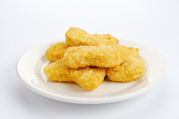 Homemade raw chicken nuggets, frozen food preparation 
