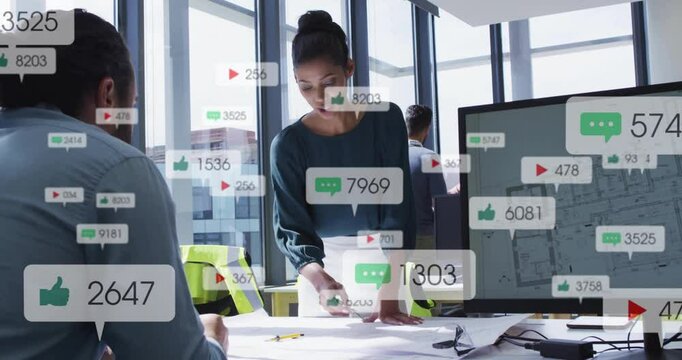 In office, business professionals collaborating with animation of social media icons floating
