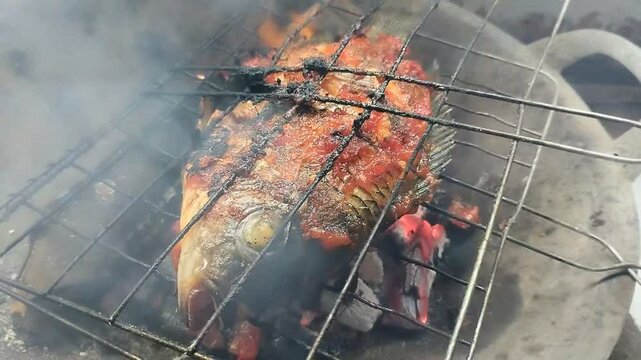 Tilapia fish (Oreochromis mossambicus) grilled with spicy spices