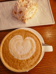 A cup of aromatic coffee with a delicate and delicious dessert