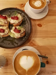 A cup of aromatic coffee with a delicate and delicious dessert