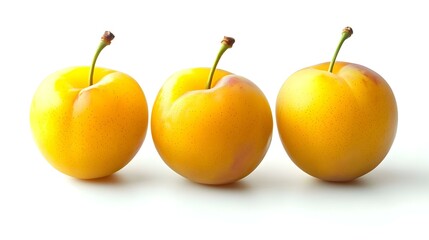 Three yellow plums isolated on white background