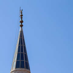 Mosque Minaret on a background of blue sky in Turkiye