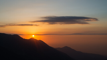 sunset among mountains and hills. Dawn in the mountains