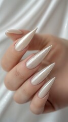 A Woman's Hand with Long Artificial Manicured Nails with White Polish Nail Art Design