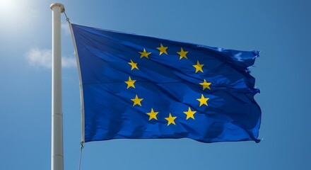 A blue flag with yellow stars blowing in the wind