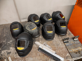 Metalworking: a welding mask on a workbench.