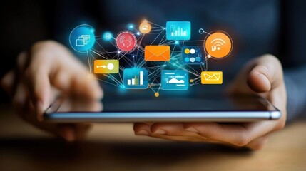 Hands holding a tablet with connected digital icons shown