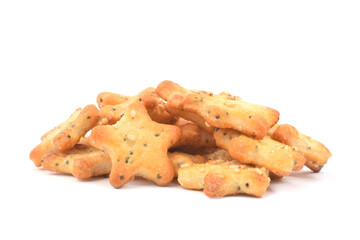 Small salted crackers are ready to eat closed up isolated on white.