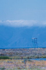 landscape with coast line of lake and mountains