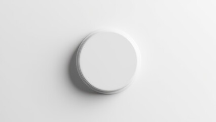 A white plastic bottle top casting a shadow on a white background.