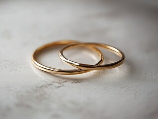 Intertwined golden rings symbolizing commitment on a subtle background