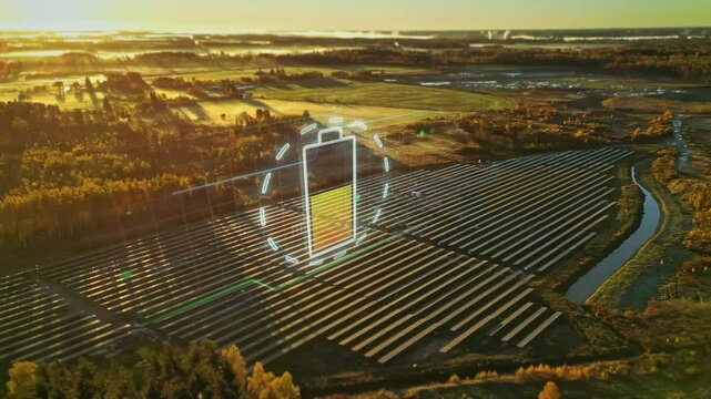 Animated Charging Battery Icon Over Photovoltaic Panels At Solar Farm. aerial shot, after-effects
