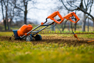 Garden tiller, rotary tiller, mini cultivator or rotavator. Tillers break up compacted soil,...