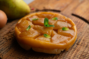 Pear tart tatin made with a traditional French recipe in a Paris restaurant.
