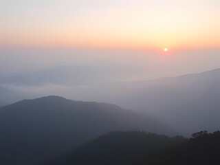 Fototapeta premium Serene Mountain Landscape at Sunrise Misty Hills, Golden Light, Peaceful Nature Scene.