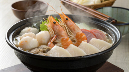 delicious bowl of Japanese hot pot featuring seafood, noodles, and fresh vegetables, perfect for cozy meal