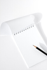 Blank Spiral Notebook With Copy Space for Writing Notes, and Pencil on White Background. 