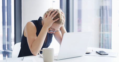 Frustrated woman, laptop and headache with stress for business crisis, financial loss or debt at...
