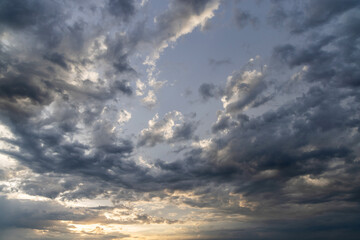A dramatic and moody sky filled with dark, swirling clouds