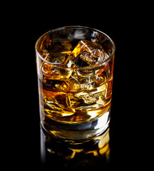 A refined glass of whiskey on the rocks